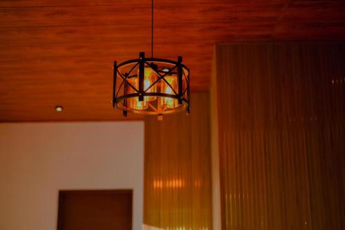 a chandelier hanging from a ceiling in a room at The Euro Lounge in Rambukkana