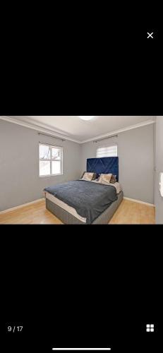 a bedroom with a bed and a window at YA Eagle Wings Self Catering Shared Single room Apt B in Cape Town