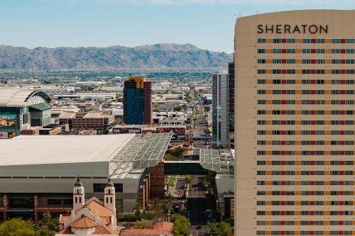 a tall building with a sheraton sign on top of it at Sheraton Phoenix Downtown in Phoenix