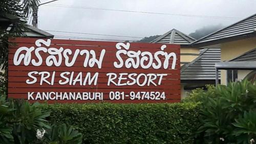 a sign for a sasanian restaurant in front of a house at Sri Siam Resort in Kanchanaburi City