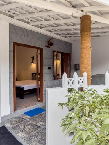 a view of a bedroom from the front of a house at Tidal Nest in Weligama