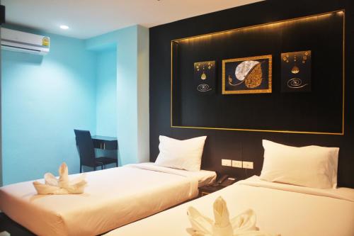 Postel nebo postele na pokoji v ubytování Metro Hotel & Spa