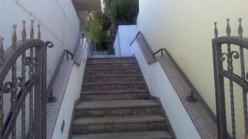 a stairway leading up to a building at Apartments Malina in Tučepi