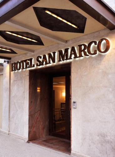 a sign on the front of a hotel san marcos at Hotel San Marco in Gubbio