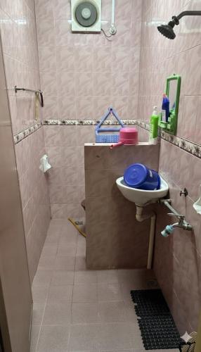 a bathroom with a sink and a shower and a toilet at Iltizam Guest House in Kuala Berang