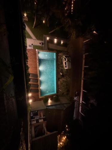 an overhead view of a swimming pool at night at Luma Malee Resort in Dickwella