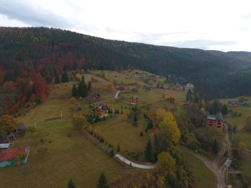 an aerial view of a house on a hill at Kozichky Guest House in Tatariv