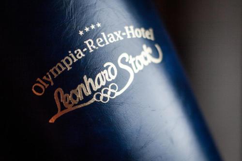 a book with writing on the side of it at Olympia-Relax-Hotel Leonhard Stock in Finkenberg