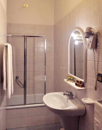 a bathroom with a shower and a sink at Hotel San Marco in Gubbio