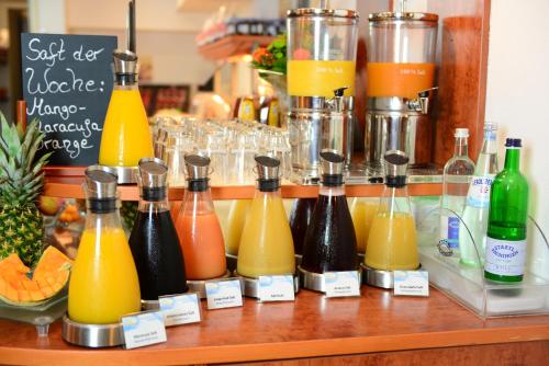 a bunch of bottles of juice on a shelf at Hotel National Düsseldorf (Superior) in Düsseldorf