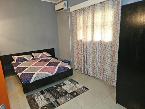 Llit o llits en una habitació de Villa Labarre