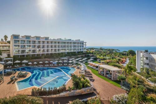 an aerial view of a resort with a swimming pool at W Algarve in Albufeira