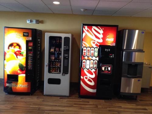 two cocacola machines are next to each other at Days Inn by Wyndham Vernal in Vernal