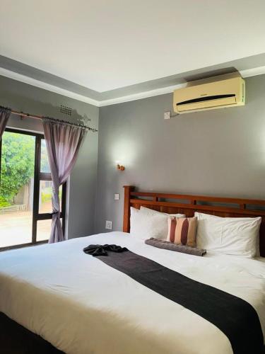 Llit o llits en una habitació de Global Guest House