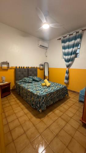 a bedroom with a bed in a room at Appt La Rose du Désert in Terre-de-Haut