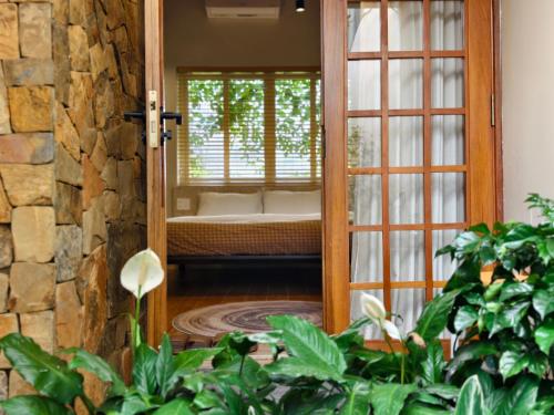 a door leading into a room with a window at Ansora Homestay Huế in Thôn An Hòa
