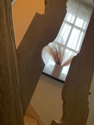 a view of a wooden staircase with a window at Ju-Jolie in Bruges