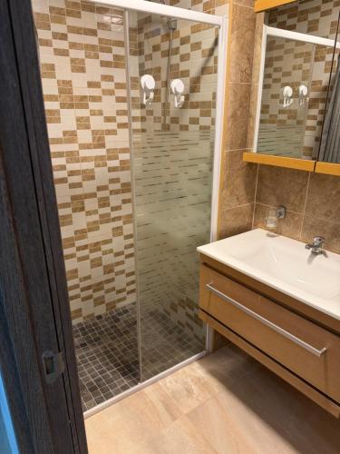 a bathroom with a shower and a sink at Sol y Sal in Torrevieja