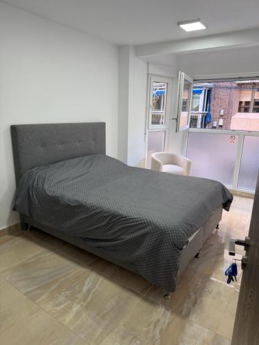 a bedroom with a large bed in a room at Sol y Sal in Torrevieja