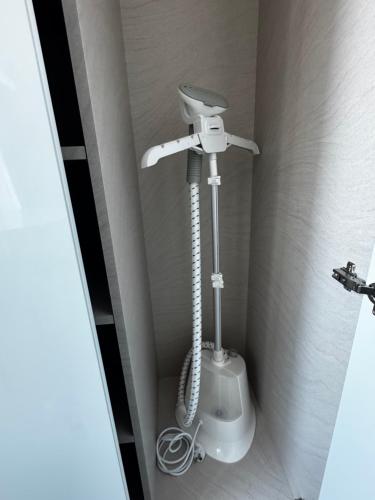 a bathroom with a white toilet in a corner at Incheon Rest Stay in Taeam