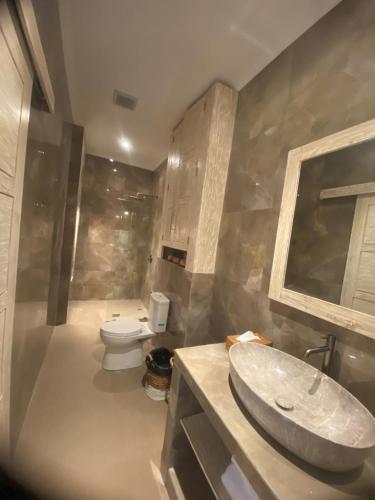 a bathroom with a sink and a toilet at the gosana in Amed