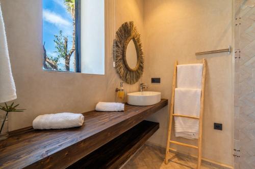 a bathroom with a sink and a mirror at VILLA 2s in Marrakesh
