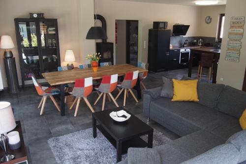 a living room with a couch and a table at Seehaus in Lenz
