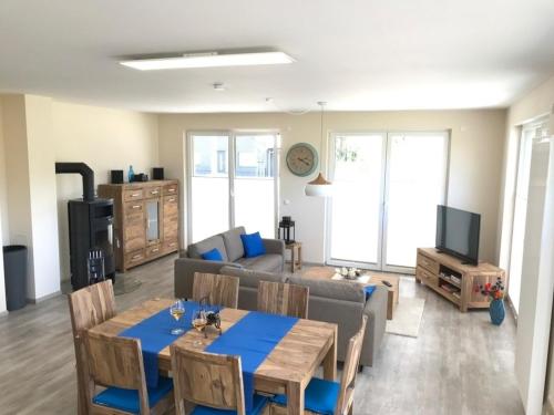 a living room with a table and a couch at Edith in Lenz
