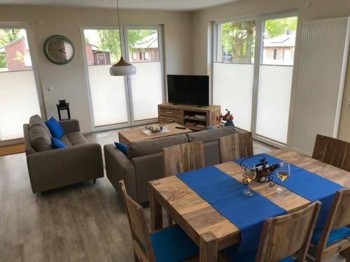 a living room with a table and a couch at Edith in Lenz