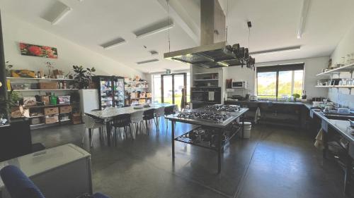 a large kitchen with a table and a dining room at Penny's Drop Inn in Cromwell