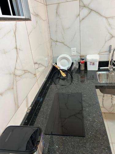 a bathroom with a toilet and a sink at Loftt concept in Rio de Janeiro