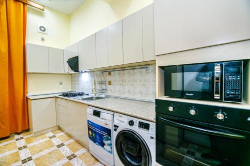 Virtuve vai virtuves zona naktsmītnē WALKER Apartment