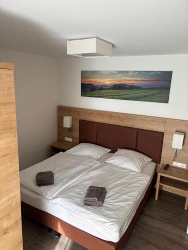 a bedroom with a bed with two towels on it at Apartment 117 in Feldberg