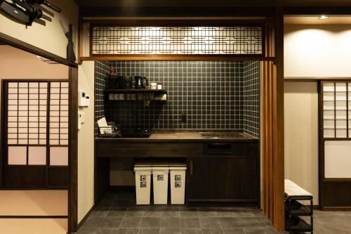 a kitchen with a sink and a counter top at 旅宿信長と忍者---2階-忍者の間---NOBUNAGAtoNINJA in Omihachiman