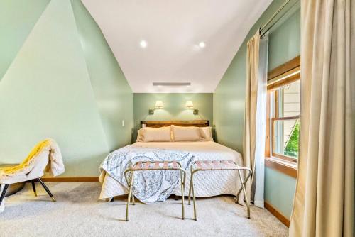 a bedroom with a bed and a window at Romantic A-frame HeartJacuzzi Firepit Kayaks in Warsaw