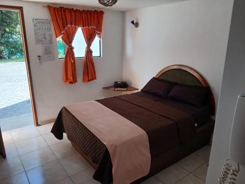 Llit o llits en una habitació de Hostal Aventura