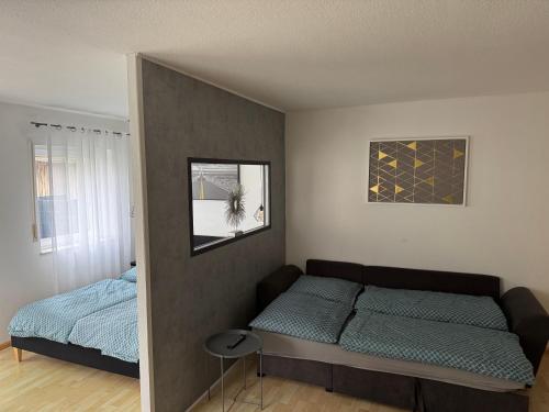 a small bedroom with a bed and a window at Appartement by Luis in Burgheim