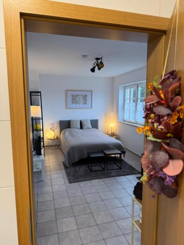 a view of a bedroom with a bed and a mirror at Apartment in Rimpar in Rimpar