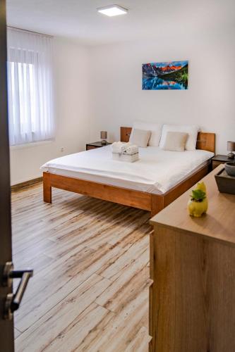 a bedroom with a large bed in a room at House Mila in Korenica