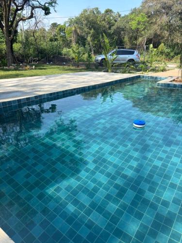 a blue swimming pool with a toy in the water at Casa en Sanber in San Bernardino