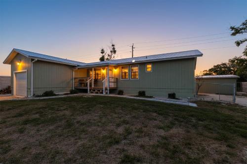 a house with a yard in front of it at Bright Furnished Home in Coastal in Englewood