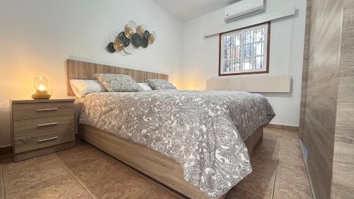 a bedroom with a bed and a window at Casa Maruca in Puntagorda