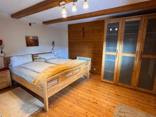 a bedroom with a large bed in a room at Ferienhaus Niederbichler in Gnesau