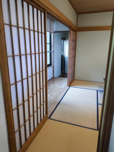 an entrance to a room with a door and a room with a room at 河津町天川旅館 in Shimo-sagano