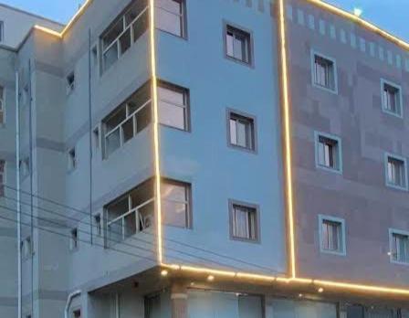 a large building with lights on the side of it at كيان الين- ابها in Abha