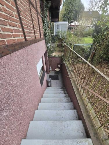 a set of stairs leading up to a brick building at Ferienwohnung Salut in Saarbrücken