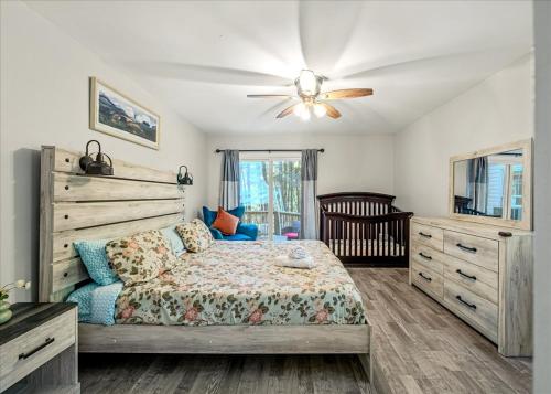 a bedroom with a bed and a ceiling fan at Pocono nirvana in East Stroudsburg