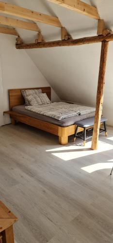 a bedroom with a bed in a attic at Pension am Bach Prinz Charming in Fuldatal