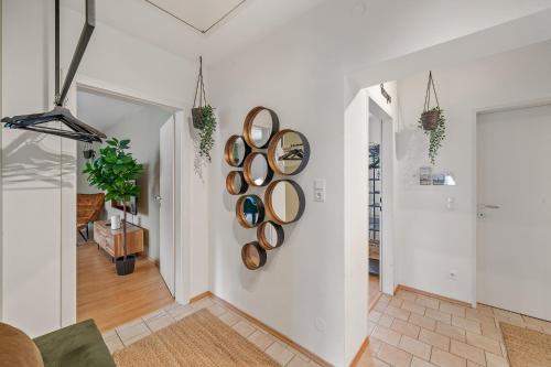 a living room with a bunch of pans hanging on the wall at dreamfactory Residences - Wine Escapes # 3BR Suite in Langenlois