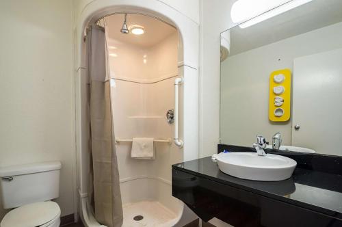 a bathroom with a sink and a shower and a toilet at Motel 6-Bessemer, AL - Birmingham in Bessemer
